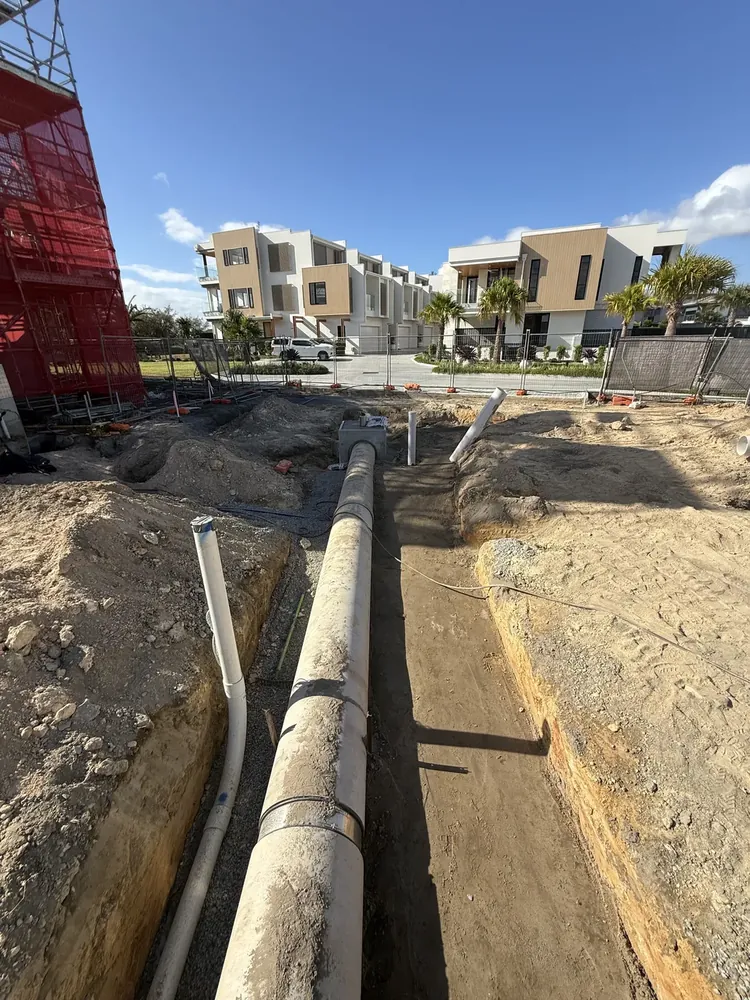 Stormwater pipe and risers in trench on a Gold Coast civil project