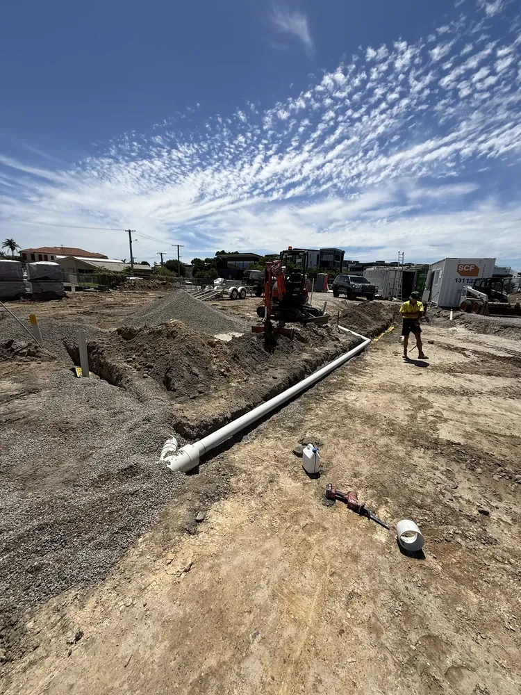 Stormwater pipe run with excavator on a Gold Coast civil site
