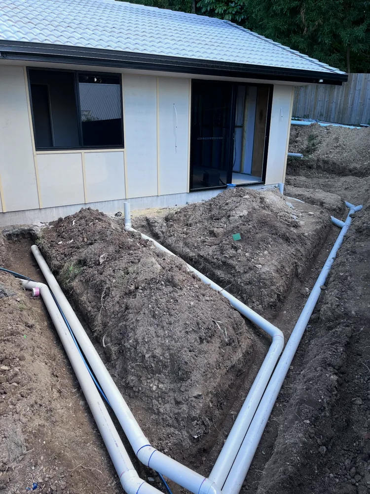New water and drainage lines trenched at a Gold Coast home