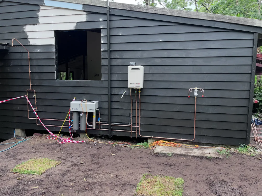 Continuous flow gas hot water and filtration system on a Gold Coast property