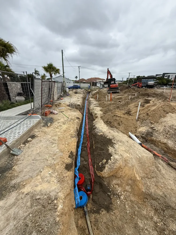 Water and power conduit laid in trench on a Gold Coast civil job