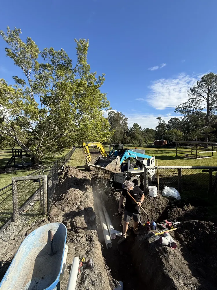 The Walter & Co crew shovelling out the drainage trench at Oxenford