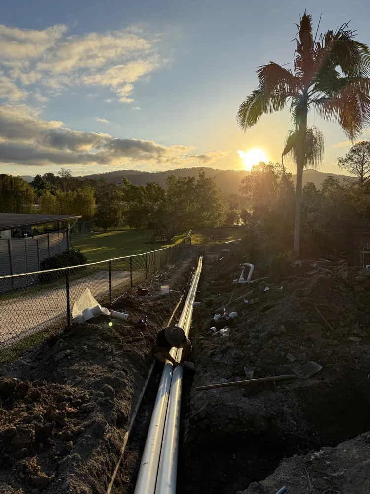 Sunset over the drainage trench run at the Oxenford job